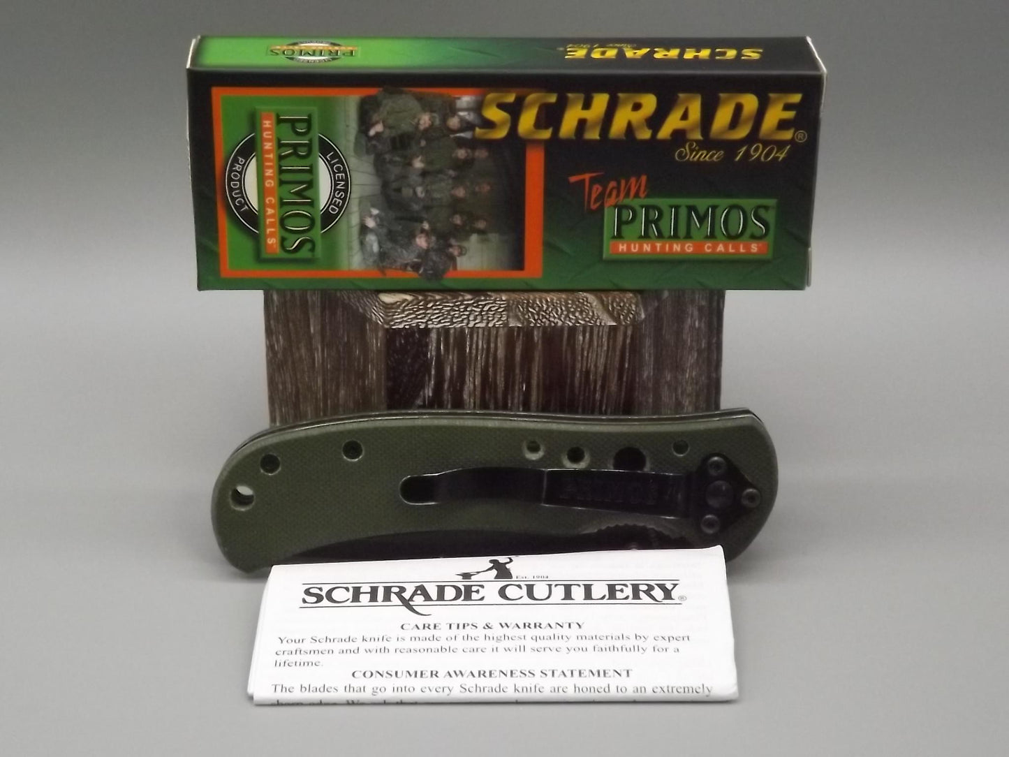 Schrade "Team Primo's" liner lock folding Tanto blade Knife. With original box and paperwork.
