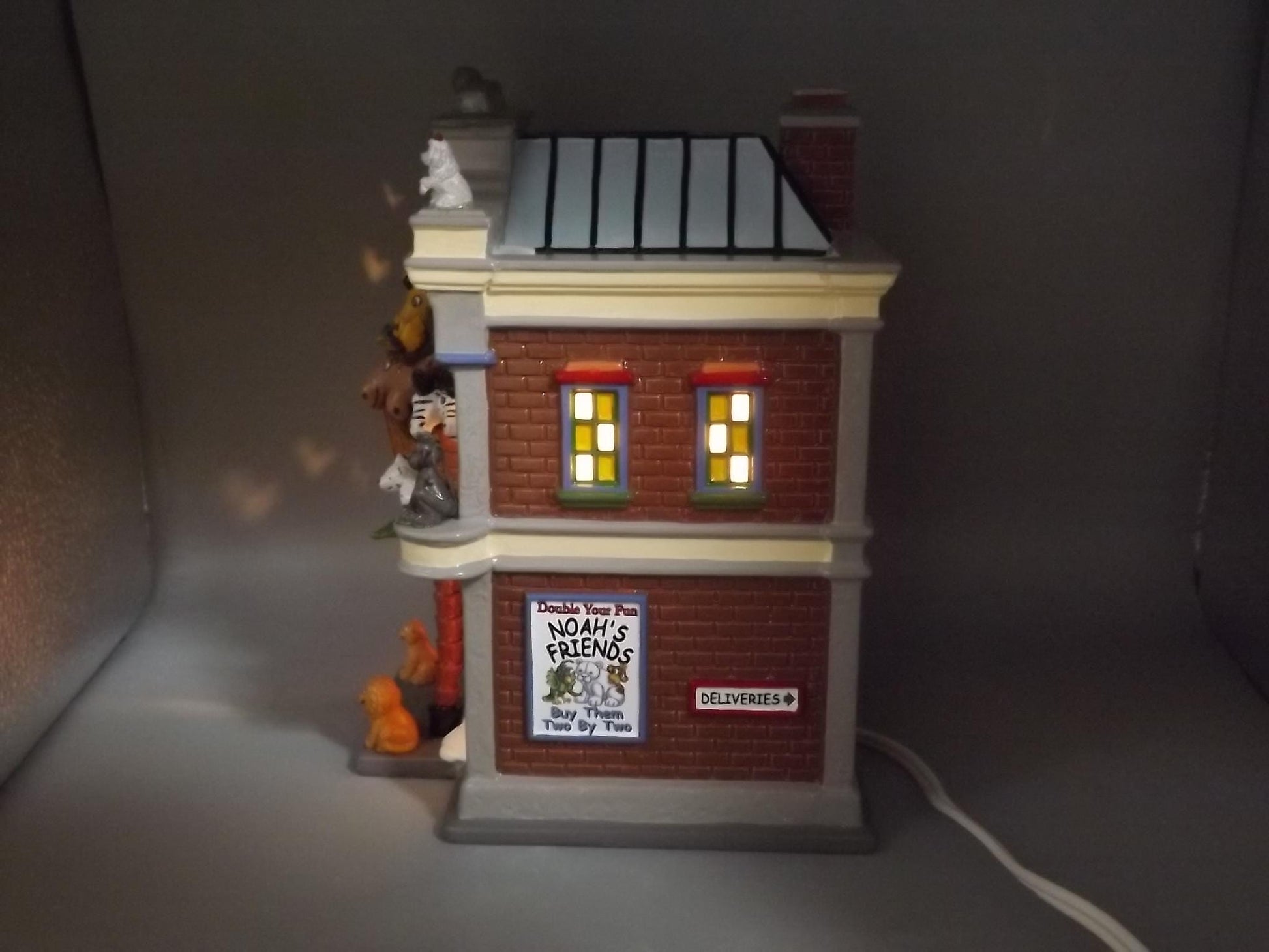 Vintage Snow Village "Noah's Stuffed Animals" Illuminated building seasonal display village scene. With box.