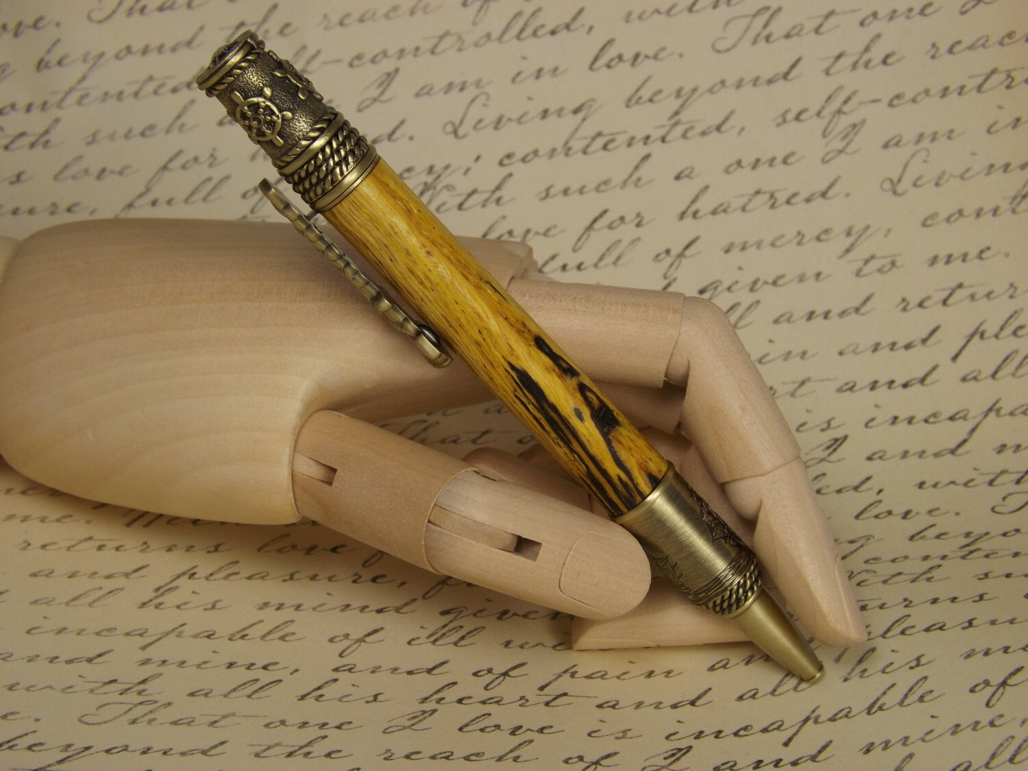 Handmade nautical pen, antique bronze with a dyed and stabilized tiger oak wood body.
