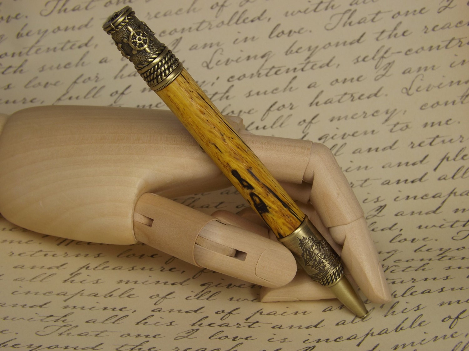 Handmade nautical pen, antique bronze with a dyed and stabilized tiger oak wood body.