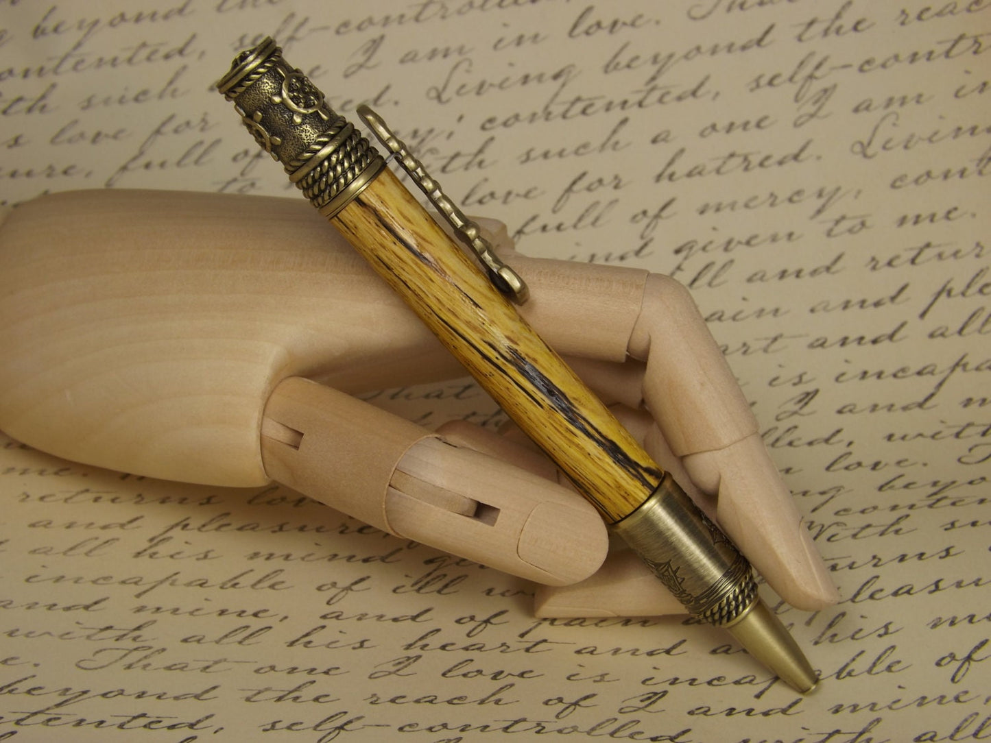 Handmade nautical pen, antique bronze with a dyed and stabilized tiger oak wood body.