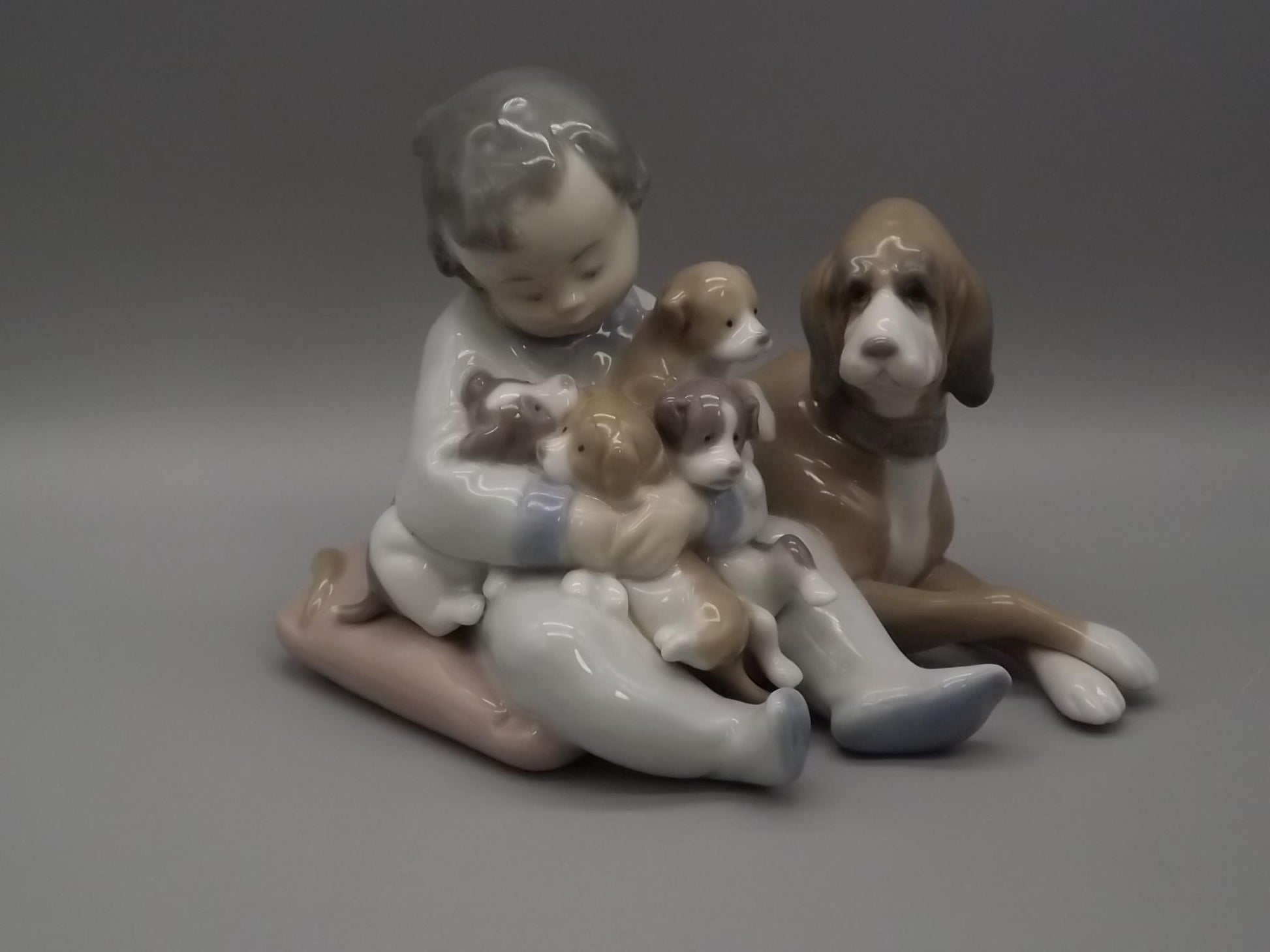 Vintage Lladro "New Playmates" Figurine: Boy with Puppies, #5456 (1988, with Box)
