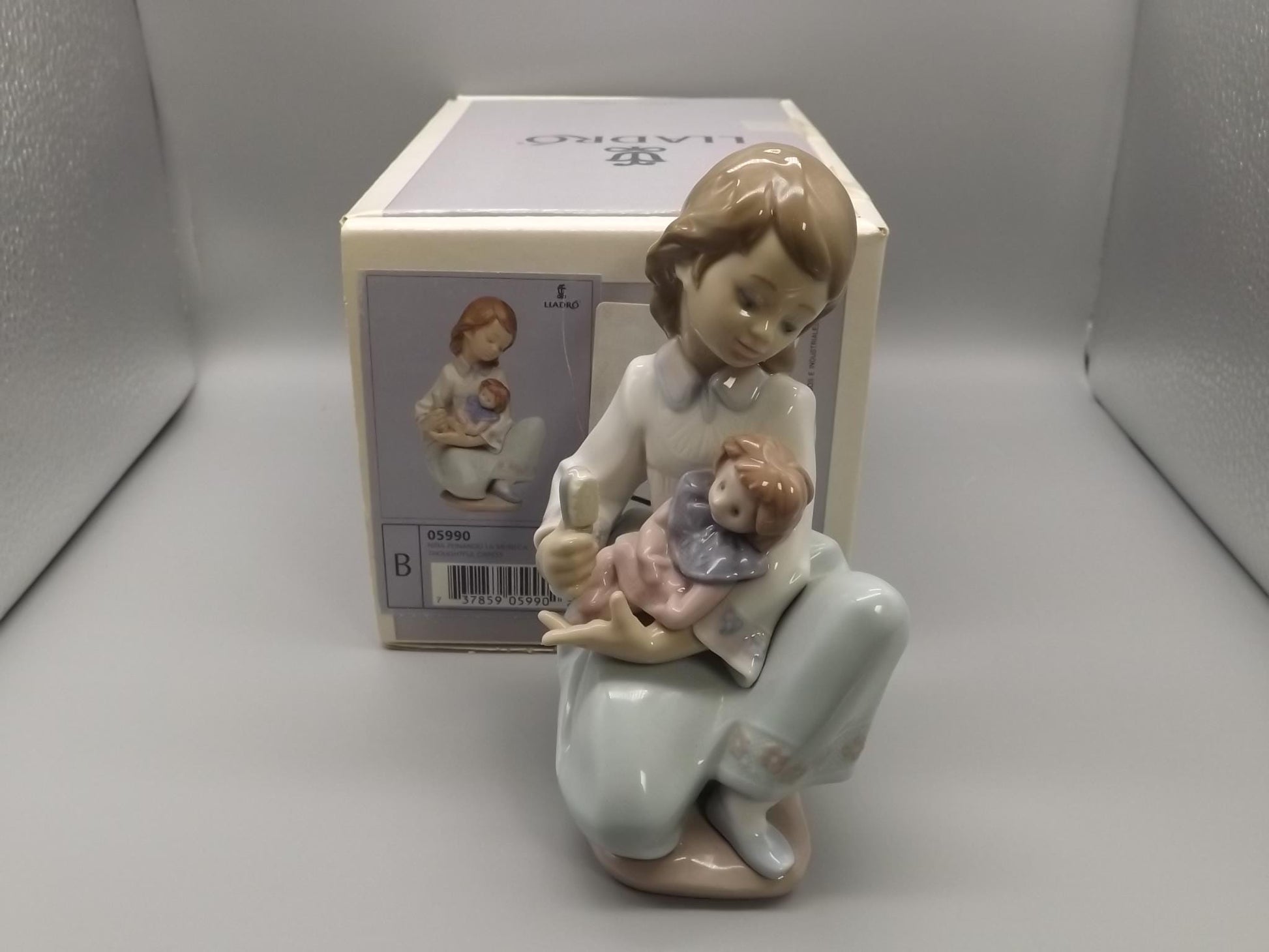 Vintage Lladro "Thoughtful Caress" Figurine: Girl with her doll, #5990 (1993, with Box)