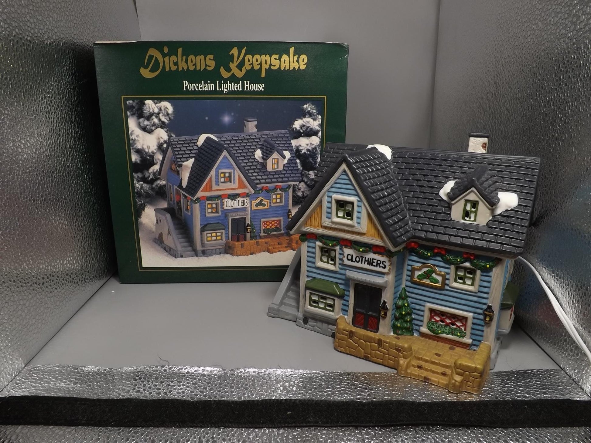 Vintage 1997 Dickens Keepsake Clothiers store Holliday display piece.